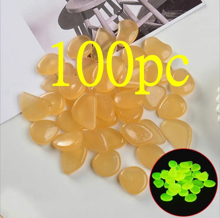 Luminous fluorescent aquarium and garden pebbles in mixed colours including dark purple, yellow, light blue, pink, orange