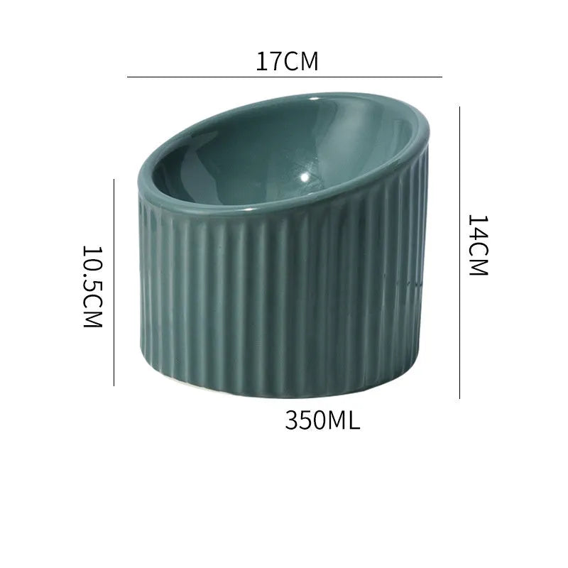 Ceramic elevated cat bowl in green colour with tilted round design for comfortable feeding.