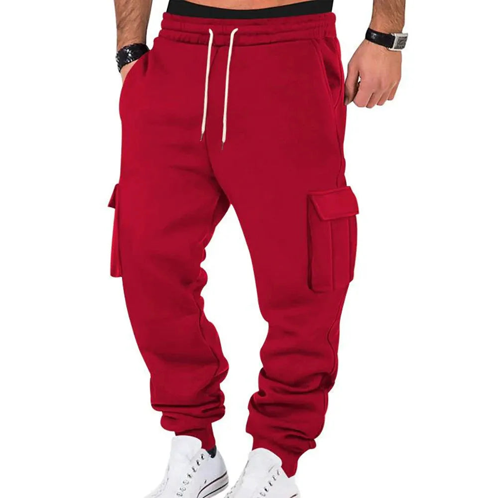 Men's solid colour casual multi-pocket drawstring sports pants in black, featuring polyester fabric and mid-waist design
