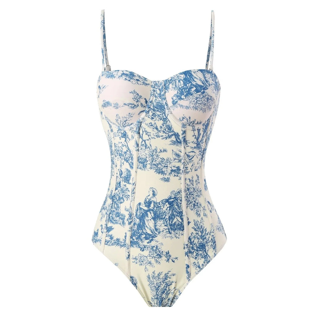 Blue women's one-piece swimsuit with matching gauze skirt on a model