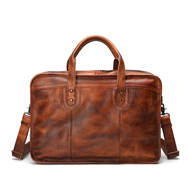 Brown vintage leather men's briefcase showing internal organiser pockets and a shoulder strap.