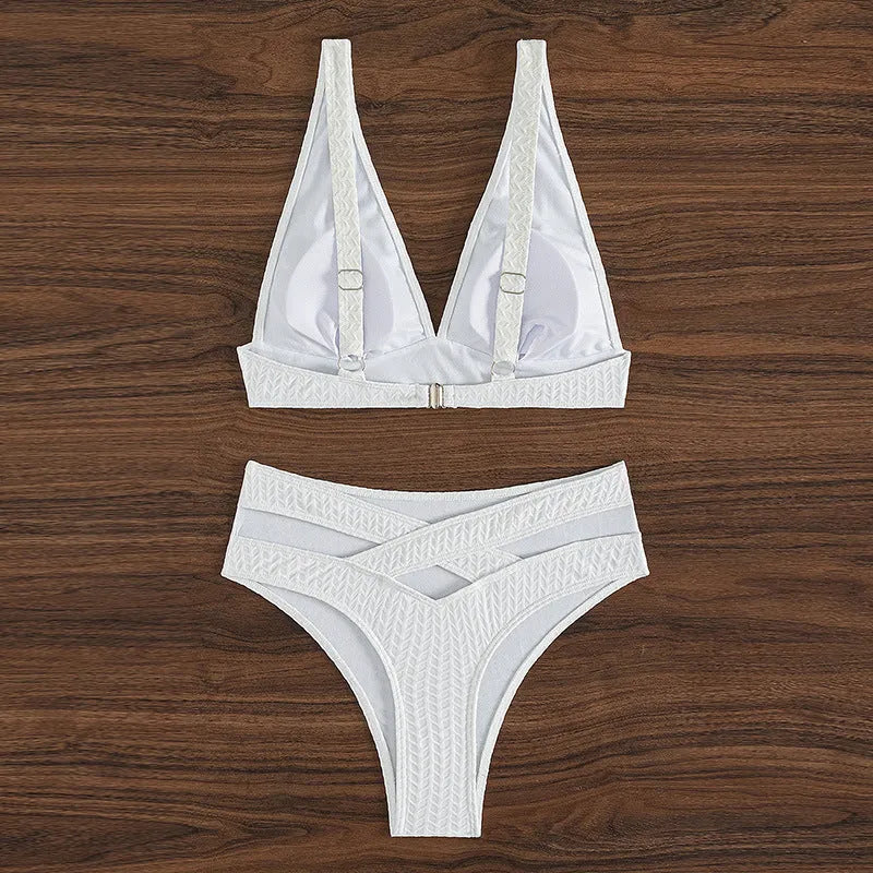 White backless women's bikini swimsuit on a mannequin