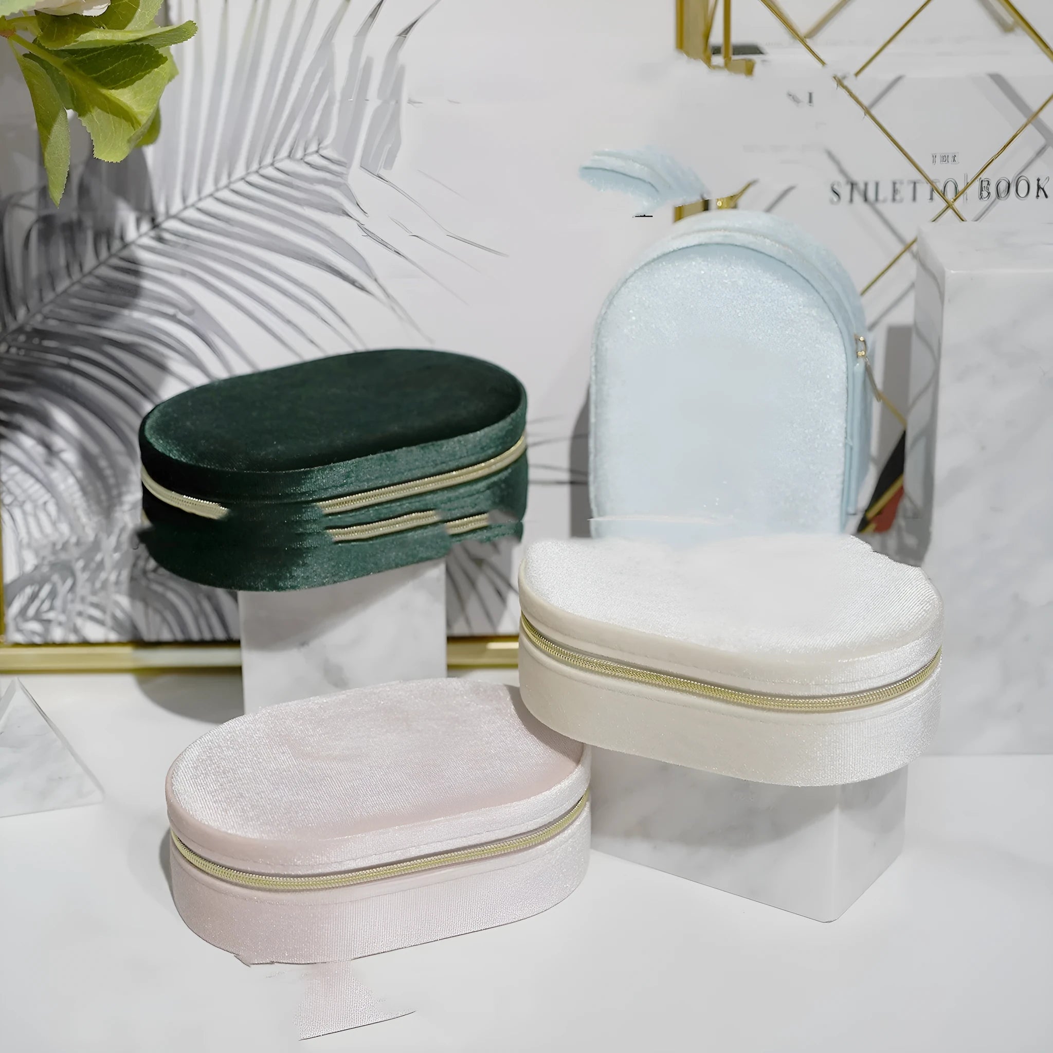 Oval velvet jewellery storage box in multiple colours with flannel lining, showing compact 15x10x5 cm size.