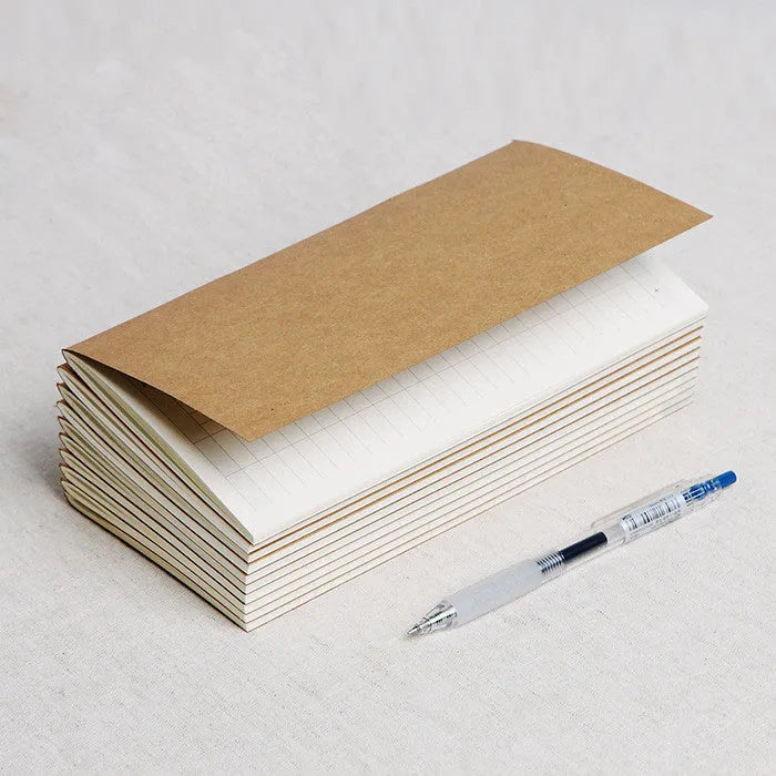 Cowhide diary refill inner core showing saddle stitch binding and 100g ivory white paper