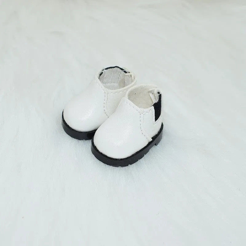 A pair of 17cm scale PU doll shoes in a selected colour and style, such as black leather shoes or brown boots.