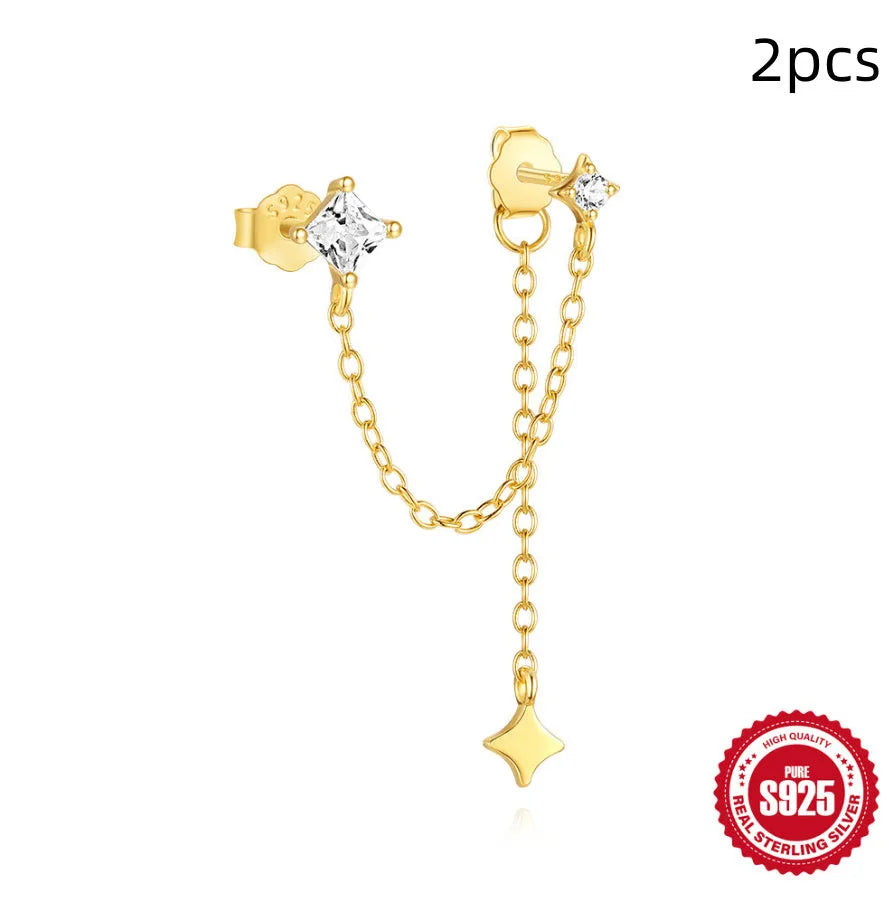 S925 sterling silver stud earring with golden double piercing design and zircon inlaid detail on a white background.