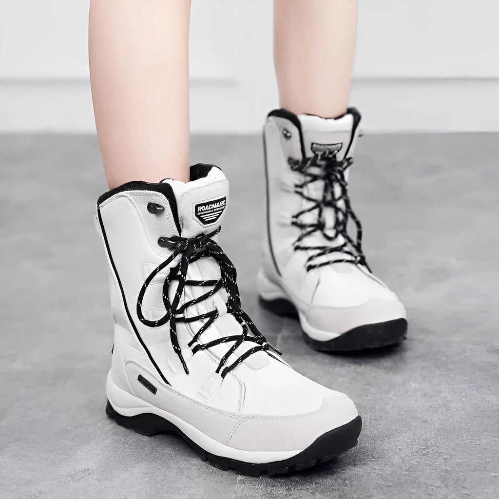 Women's black thermal snow boots with genuine leather upper and rubber sole
