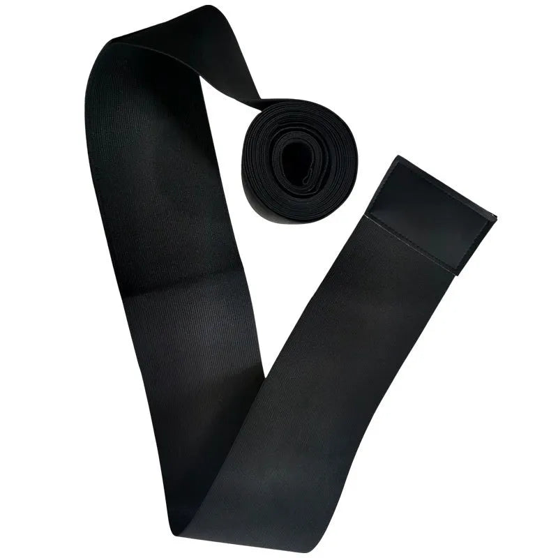 A long roll of a black latex silk waist trainer restraint belt, showing its 10cm width, laid flat.