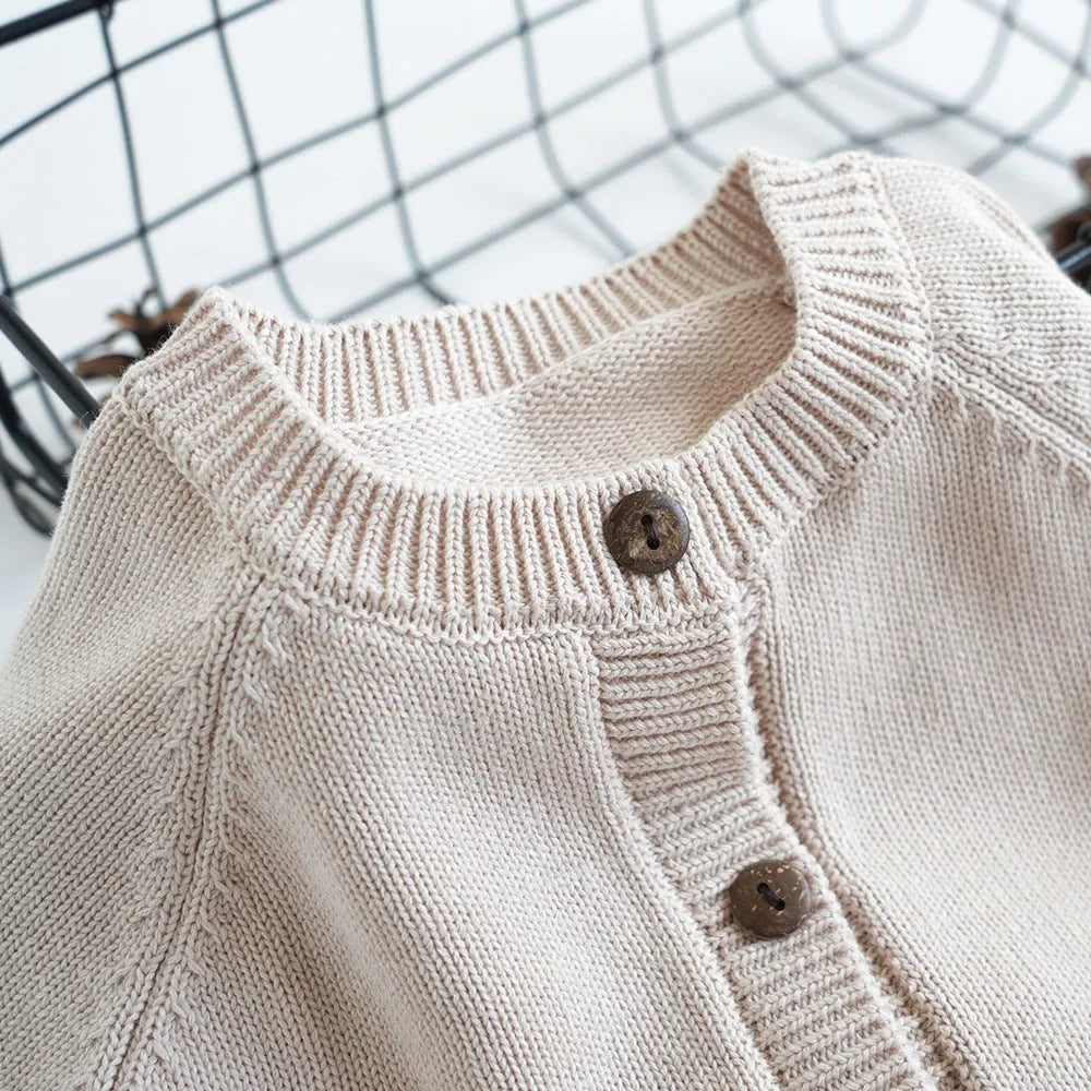 Kids cotton knit sweater with squirrel embroidery in beige colour on white background