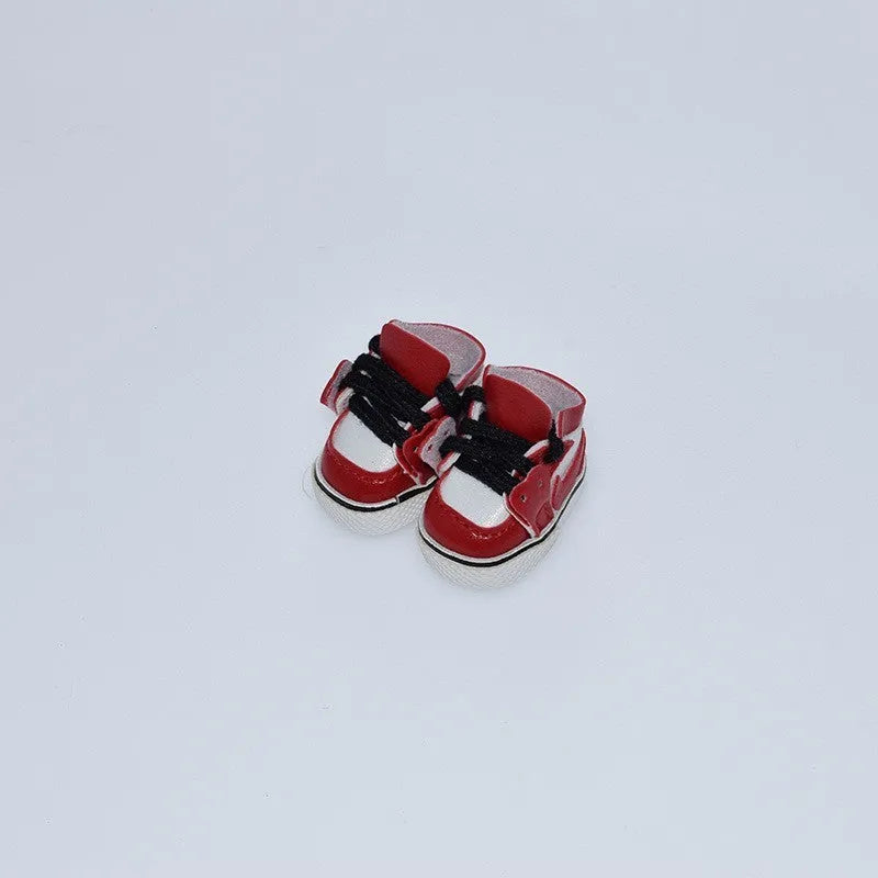 A pair of 17cm scale PU doll shoes in a selected colour and style, such as black leather shoes or brown boots.