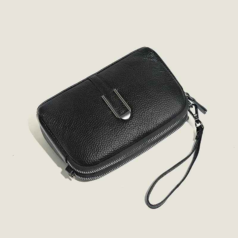 Minimalist crossbody bag in top-grain leather, horizontal square shape, available in five colours including khaki and black