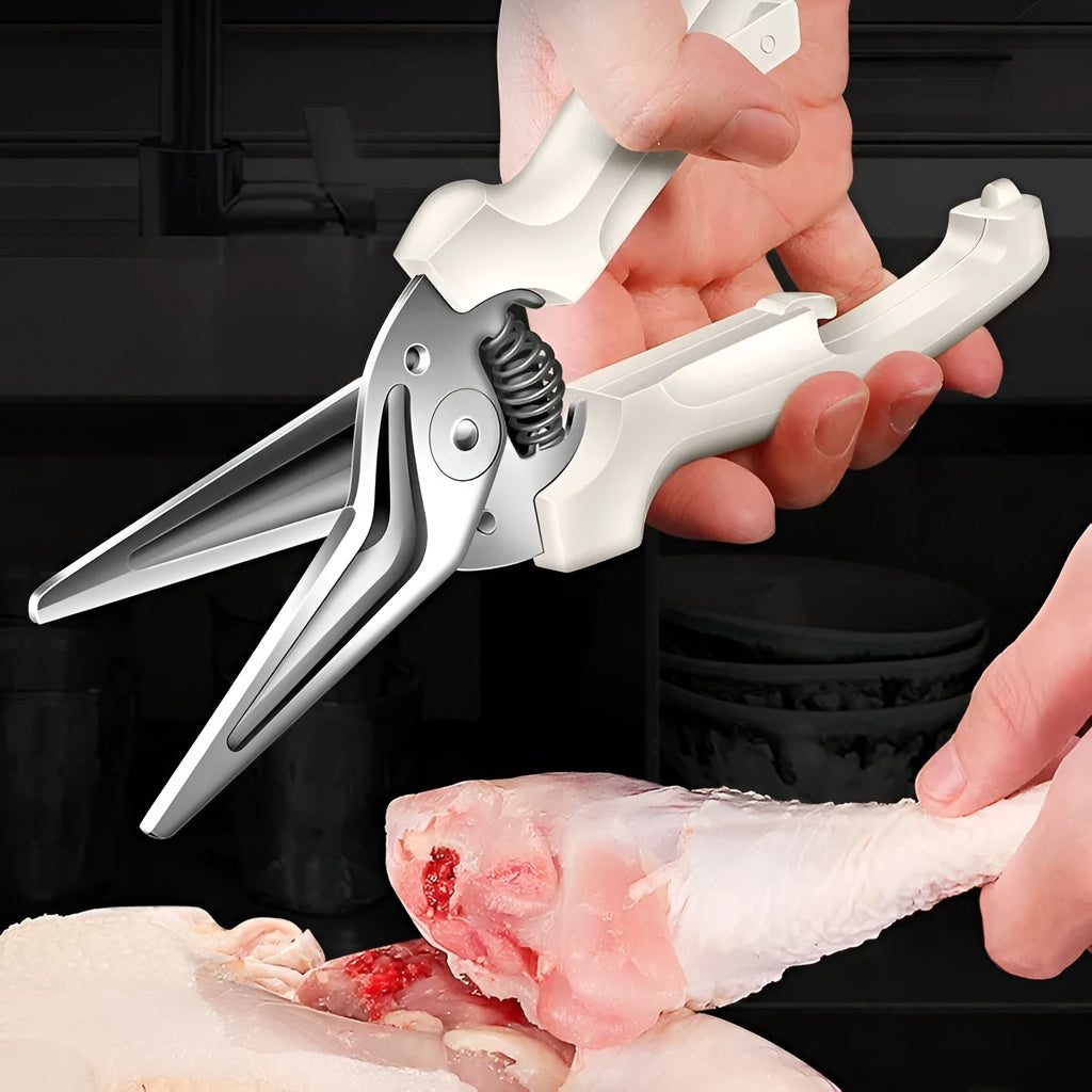 Creative magnetic suction kitchen scissors in stainless steel on a fridge door