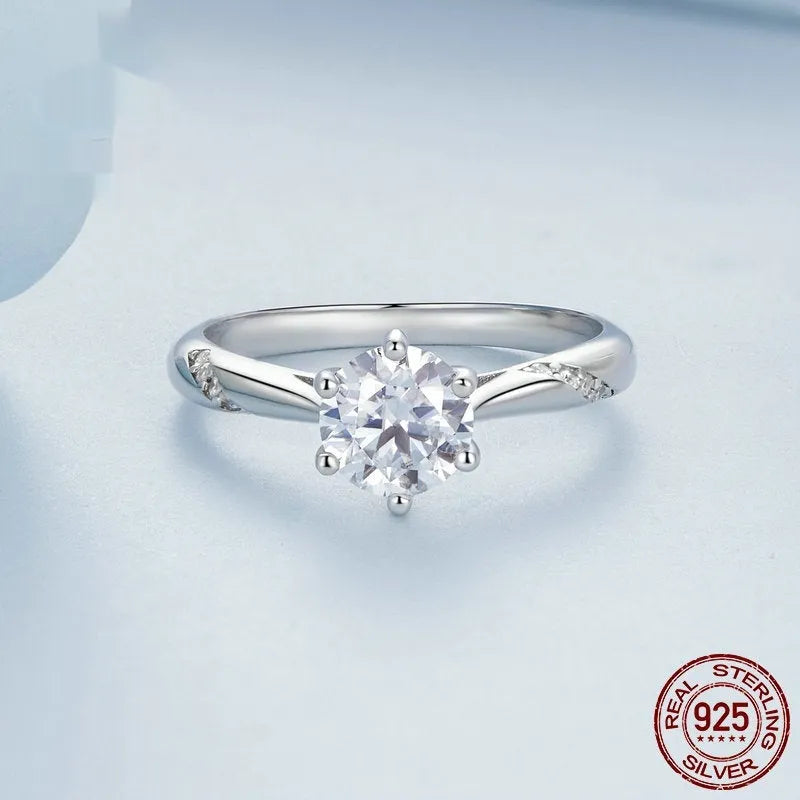 Silver moissanite ring with 1 karat main stone, electroplated finish, size US7 on a white background.