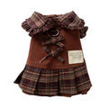 Fleece-lined brown plaid pet sweater dress with ruffle trim on a small dog, showing stretchable knit and skirt silhouette
