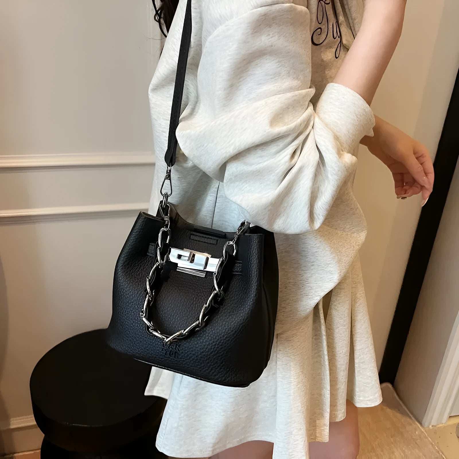 Women's black PU retro bucket shoulder bag with chain detail and multiple internal pockets