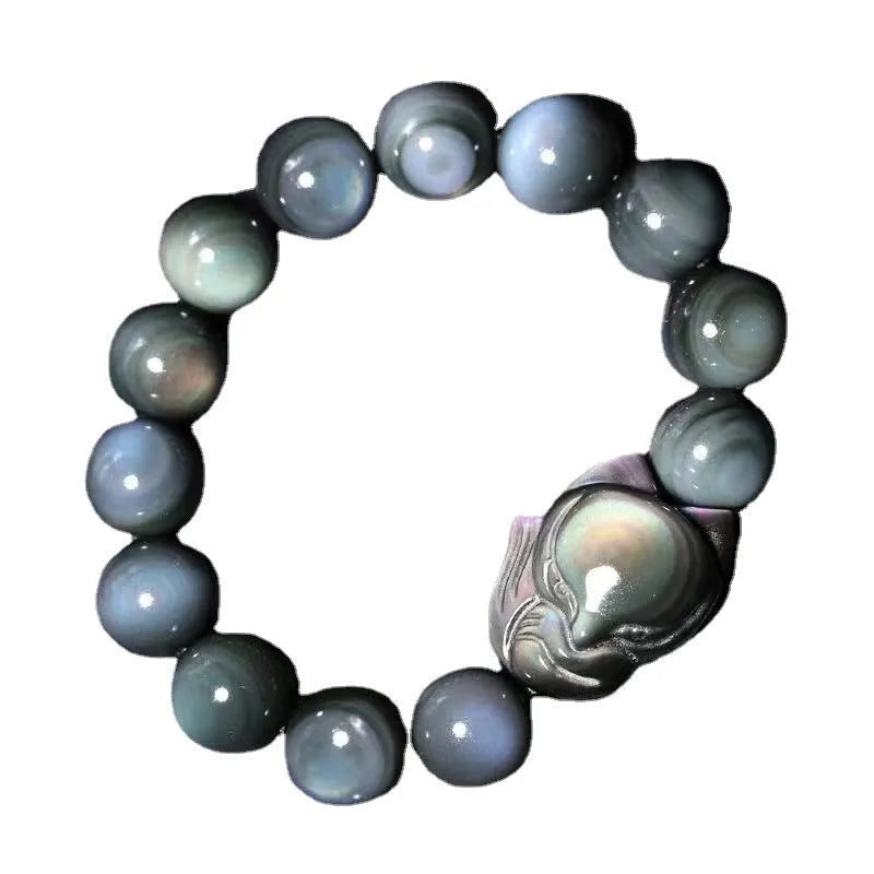 Obsidian stone bracelet with carved fox design in cartoon style, shown in various sizes