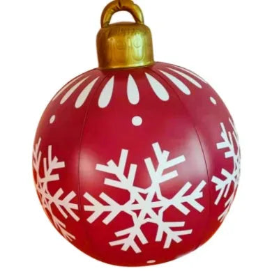 Large red and white striped inflatable Christmas ball ornament hanging on an outdoor tree