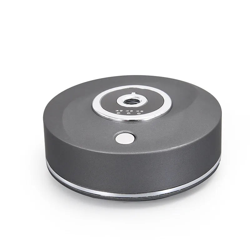 White, grey, and black USB car aromatherapy diffuser with anti-slip pad for dashboard mounting.