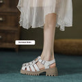 Women's beige retro platform sandals with chunky rubber sole and buckle closure.
