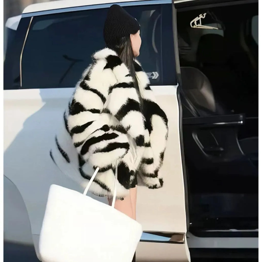 Women's zebra stripe fur top with long sleeves and skimmer collar, medium length animal print casual wear