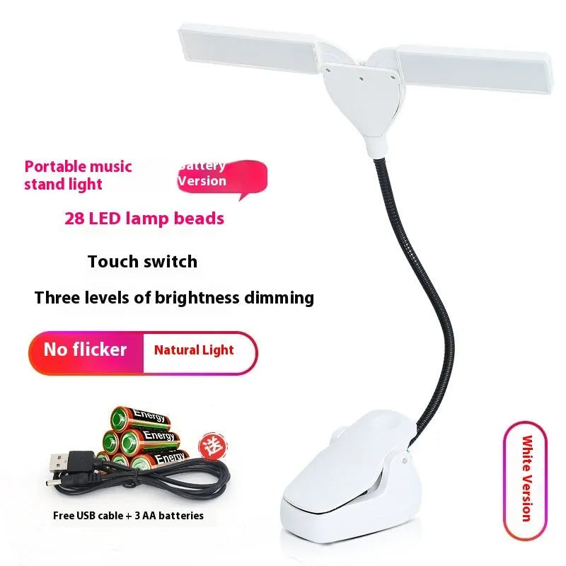 Black rechargeable music stand lamp with 28 LEDs and USB cable on a music stand.