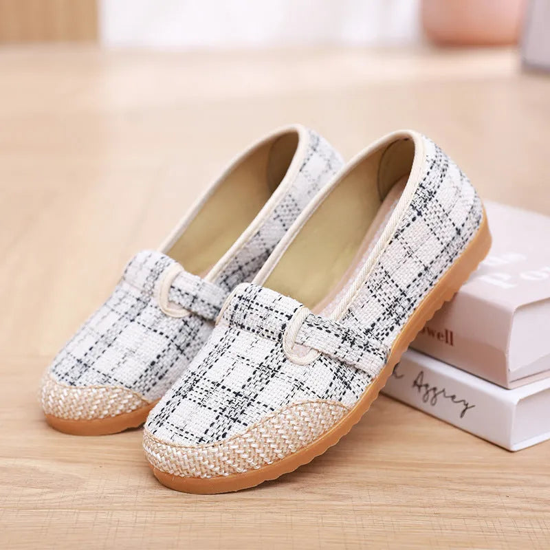 Women's flat heel ethnic cloth shoes in red, green, black, beige, or blue with colour stitching and a shallow mouth.
