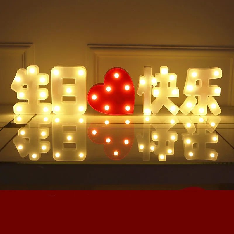 Plastic LED letter light decoration spelling a message, 22cm in height.