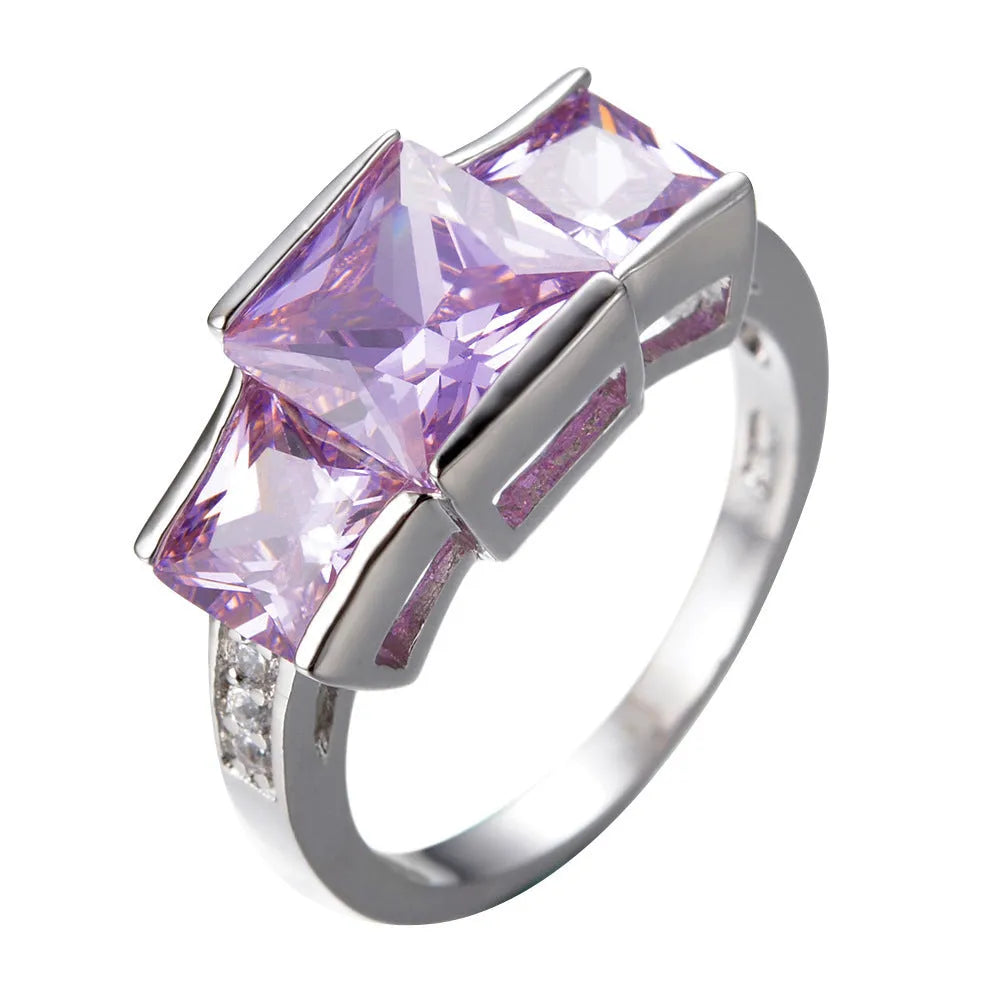 Geometric wholesale ring ornament in electroplated copper showing multiple colour options on a size 8 finger