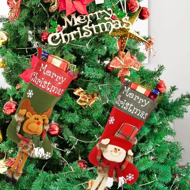 Three large Christmas stockings with Santa, Snowman and Reindeer 3D designs hanging for holiday decoration