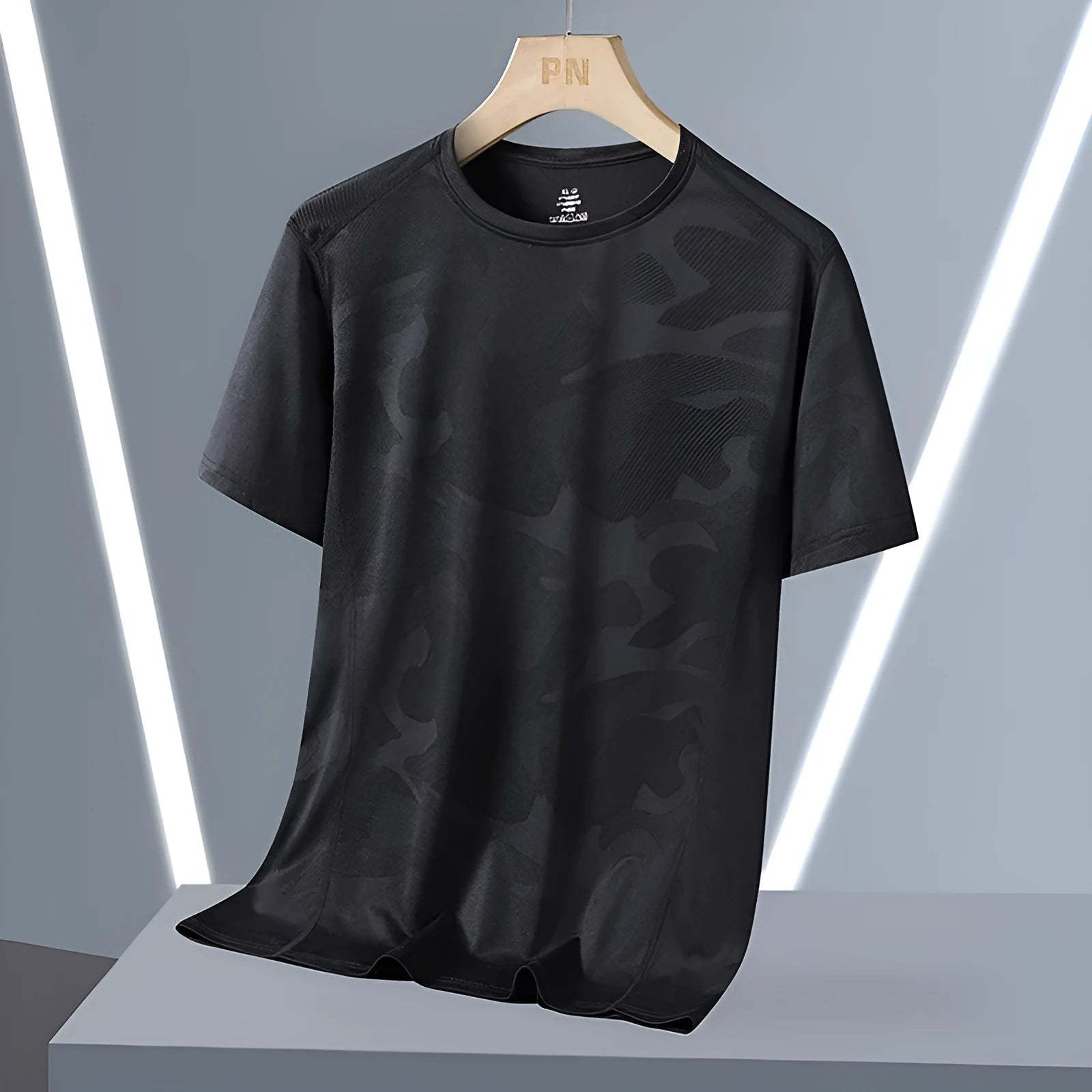 Men's camouflage pattern short sleeve t-shirt in plus sizes on a hanger.