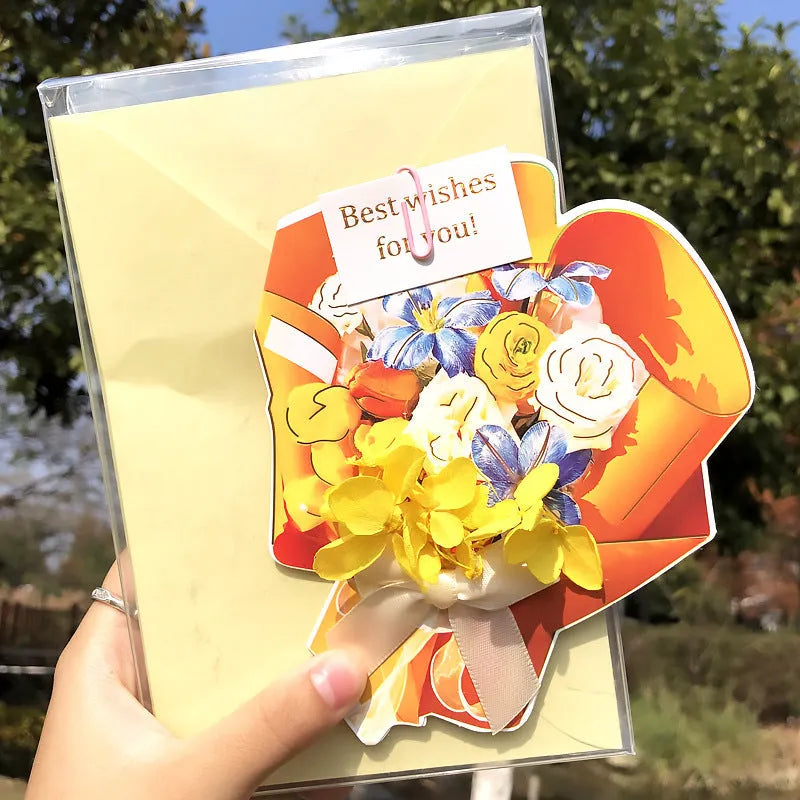 Handmade 3D butterfly-shaped greeting card with artificial flowers in a box, alongside its matching envelope.