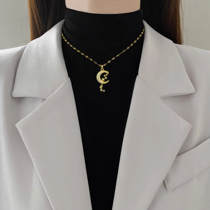 Geometric moon tassel necklace with diamond-cut facets and stainless steel chain