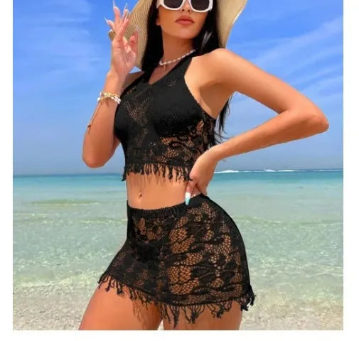 Women's two-piece bikini swimsuit with lace detail and attached tassel skirt cover-up in black or white