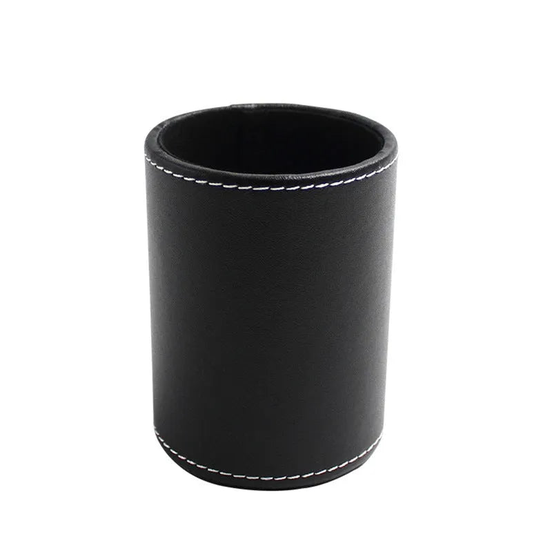 Black leather round pen container on desk with dimensions 8.0cm diameter 10.8cm height