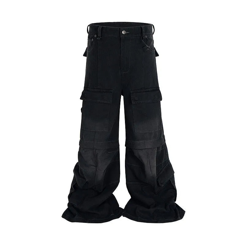 Black washed-out cotton overalls with detachable straps and multiple pockets on a hanger.