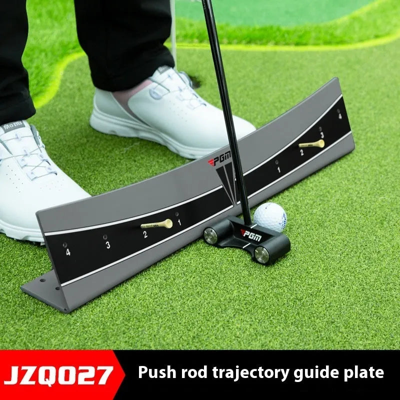 A white PVC golf putter trajectory balance simulator with an adjustable push rod balancer on a grey surface.