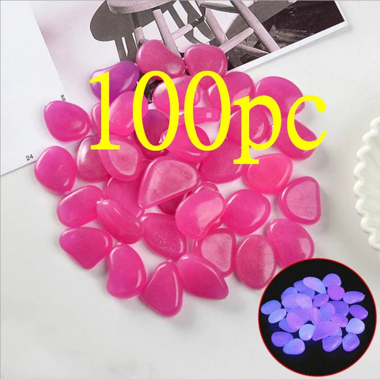 Luminous fluorescent aquarium and garden pebbles in mixed colours including dark purple, yellow, light blue, pink, orange