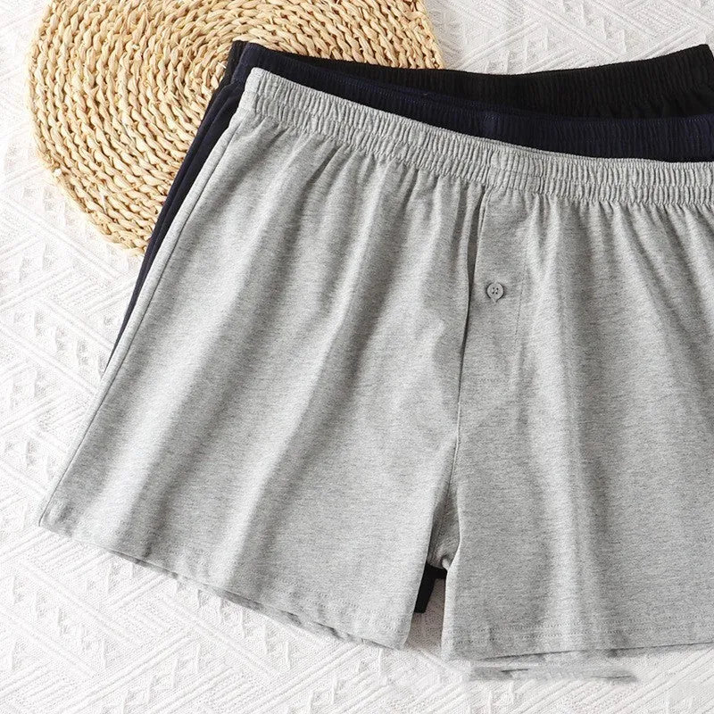 Men's solid colour cotton boxer shorts on a white background, showing loose fit and high waistband.