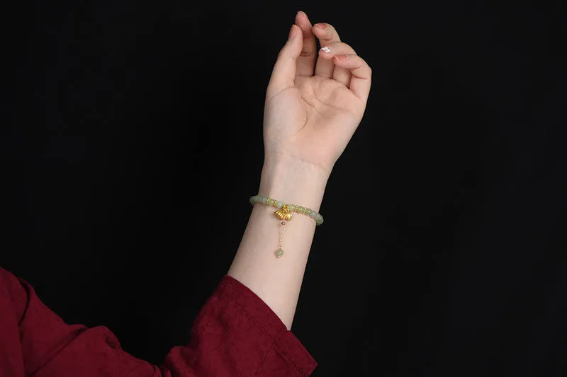 Natural Hetian Jade bracelet with six millimetre beads in step by step lotus pattern