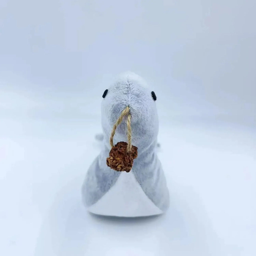 Blue sea lion shaped cat plush toy with bell sound feature and attached gall fruit teaser