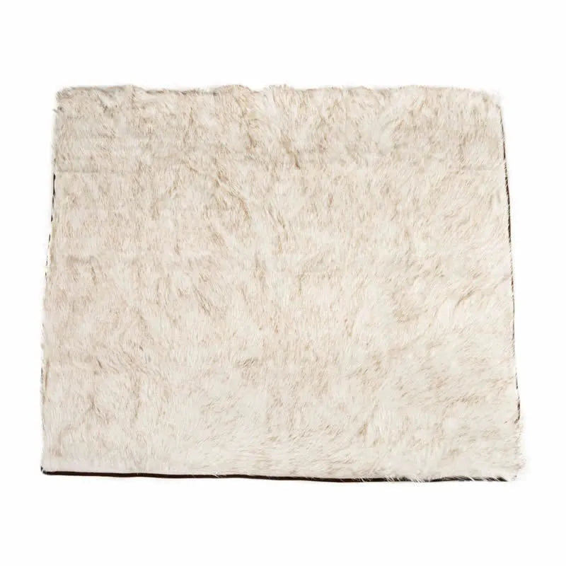 White with brown accents machine washable waterproof dog couch bed on a floor