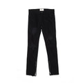 Men's high street style black torn jeans in washed black denim with raw edge details, front view.