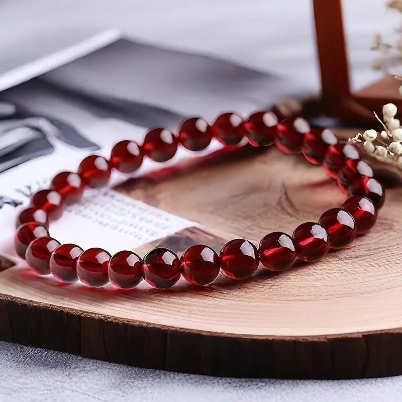 Chinese style gourd bracelet with imitation garnet stones and cultural motifs including Fu character design