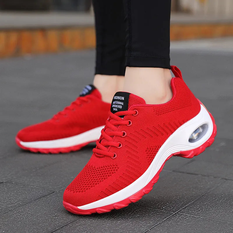 Red and black women's low-top mesh sneakers with front lace-up and a round toe.