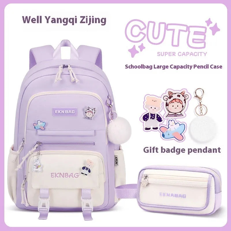 Girls' pink waterproof Oxford cloth school backpack with curved shoulder straps.