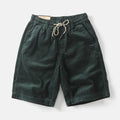 Men's khaki cargo shorts with straight leg fit and fifth pants length, showing multiple cargo pockets