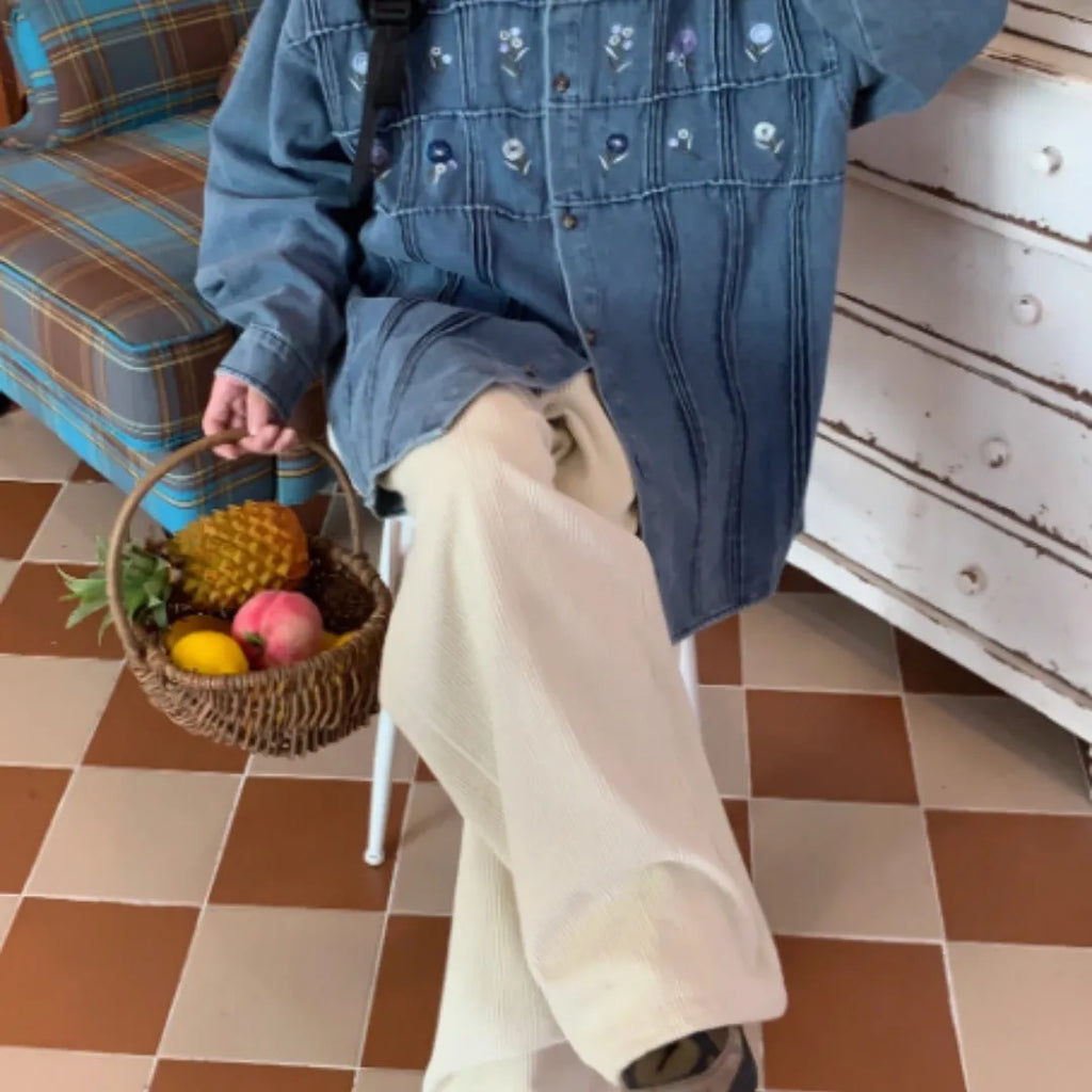 Vintage washed blue denim shirt with small floral print and pleated front on long sleeves