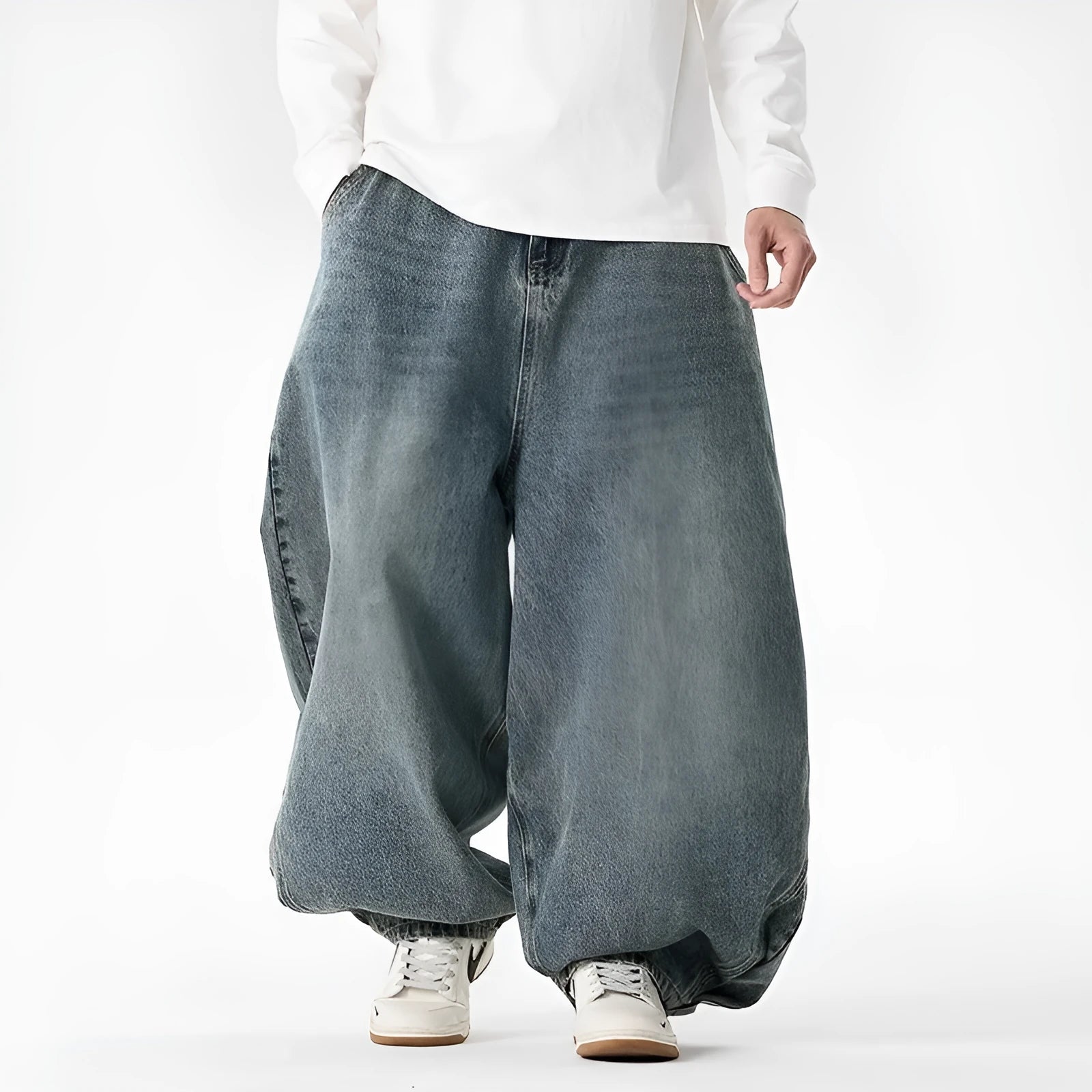 Men's plus-size light blue wide-leg baggy denim jeans on a hanger.