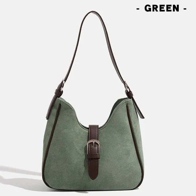Retro suede leather underarm shoulder bag in brown with double connector straps on a white background