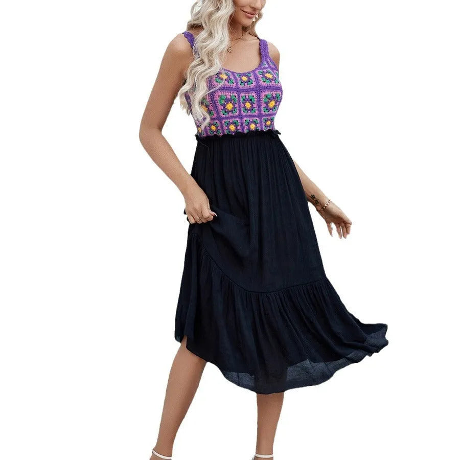 Purple sleeveless dress with hand-hooked white floral embroidery, shown on a hanger.